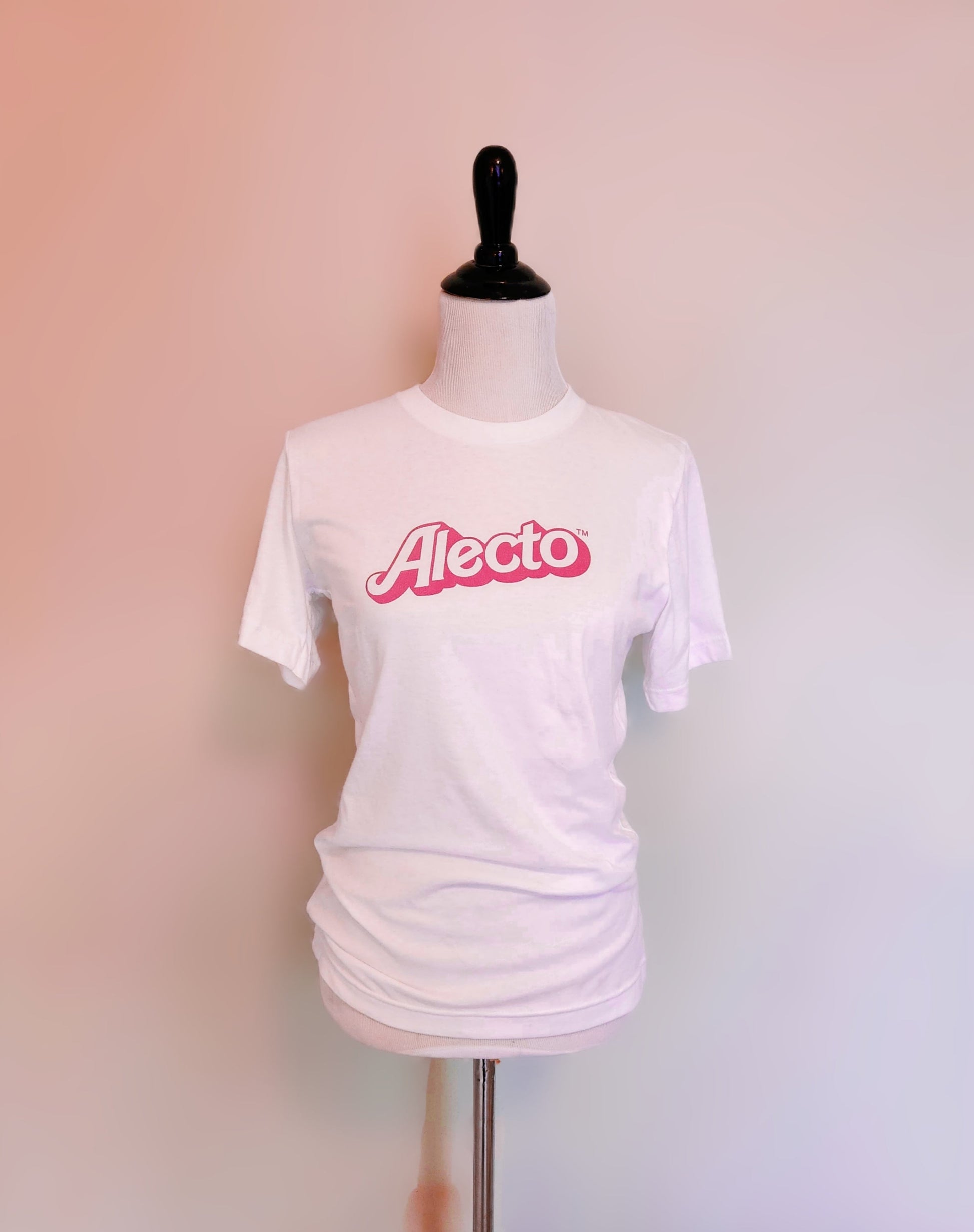 White t-shirt with 'Alecto' logo on a mannequin against a gradient background