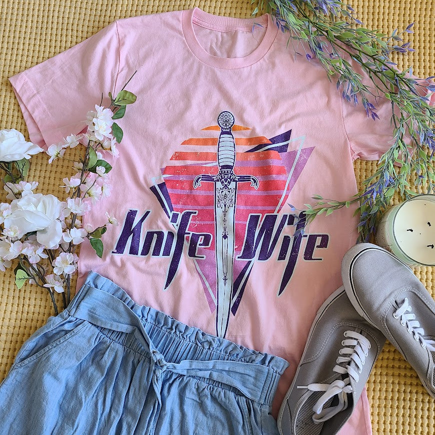 Knife Wife shirt in an 80s style print styled with a summer outfit flatlay