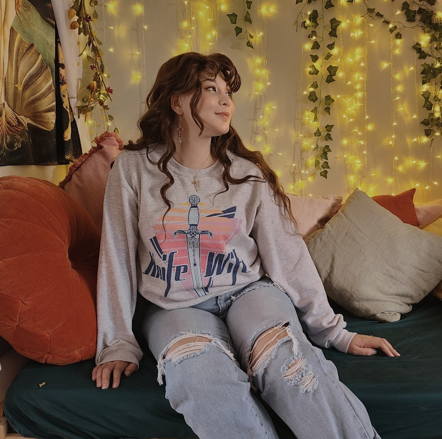 Knife Wife sweatshirt in an 80s style print modeled in a jude duarte aesthetic 