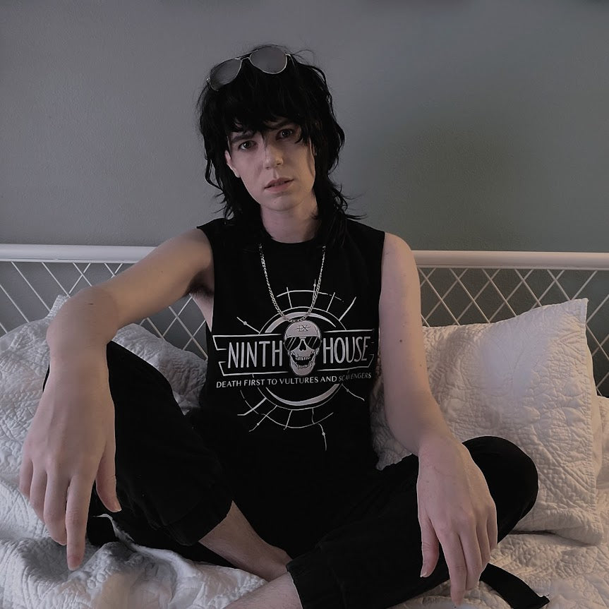 Gideon the ninth themed ninth house shirt in black with skull and the phrase "death first to vultures and scavengers" styled with the sleeves cut off and aviator glasses