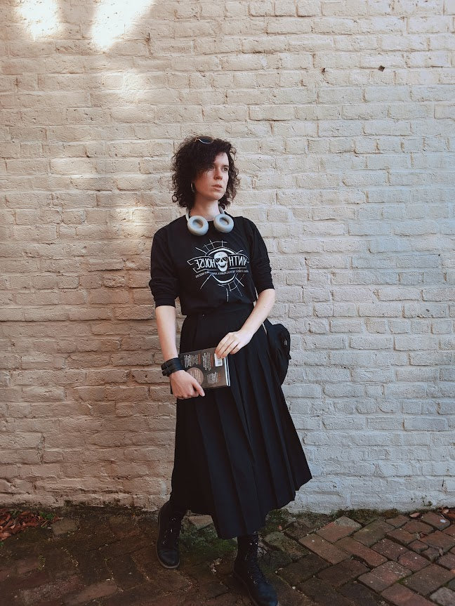 Gideon the ninth themed ninth house long sleeve shirt in black with skull and the phrase "death first to vultures and scavengers". Modeled by Mar