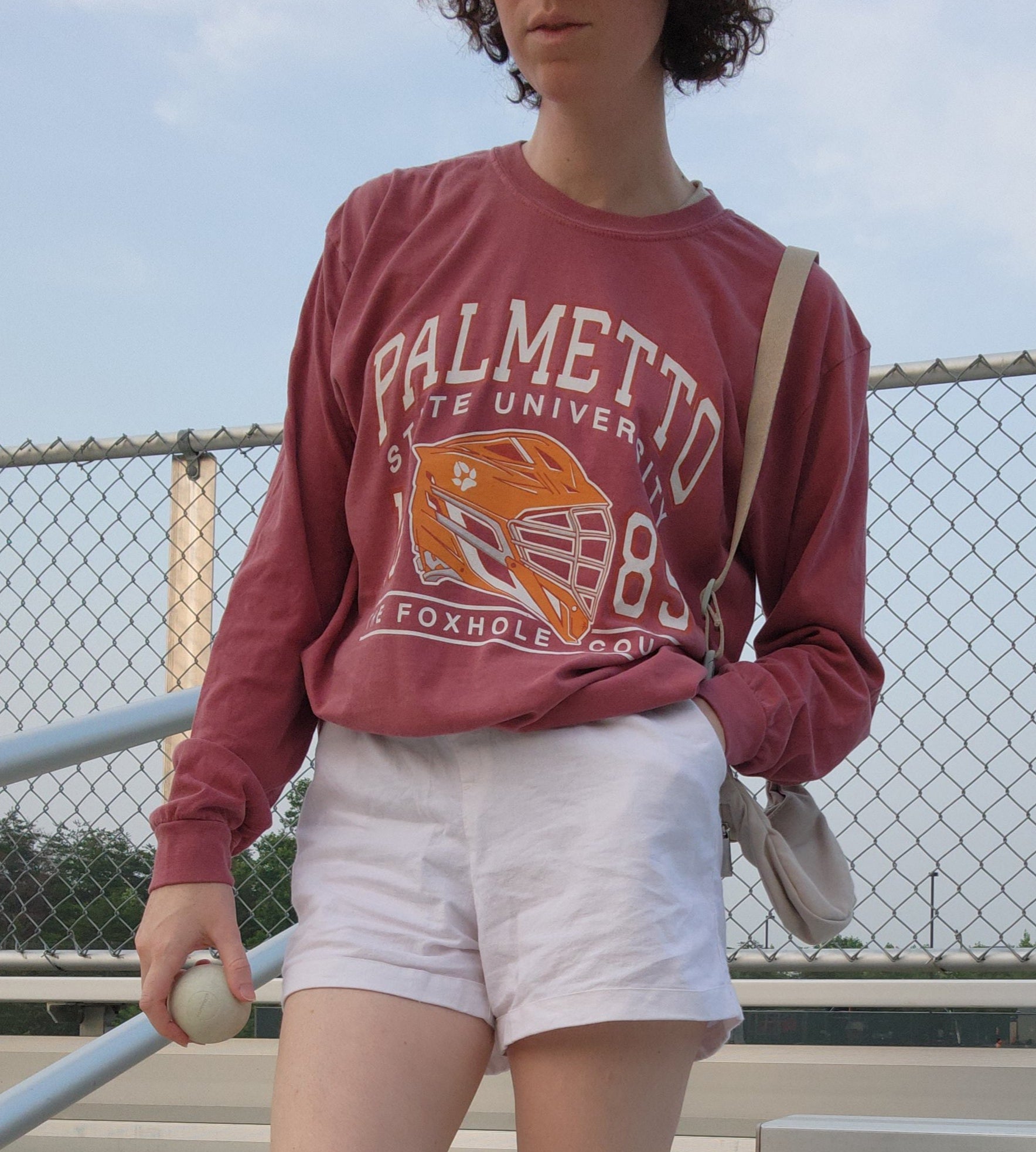 Photo of the palmetto long sleeve shirt in rust worn on a model