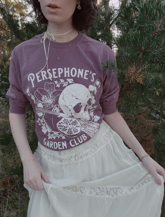 Persephone's Garden Club  long sleeve shirt in purple with pomegranates and skull styled with a white flowy skirt