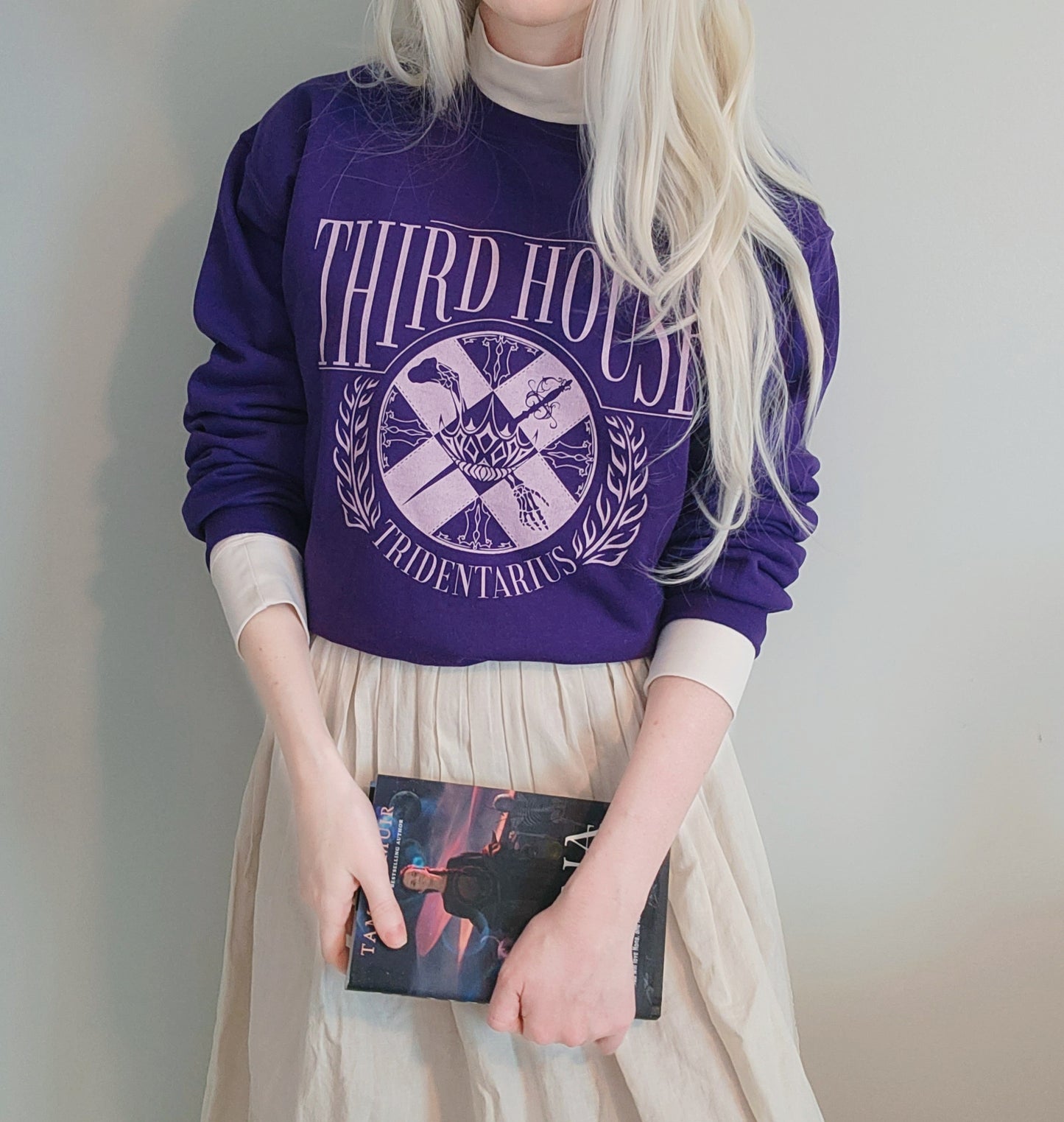 The locked tomb gideon the ninth third house sweatshirt in purple on model with ianthe type hair