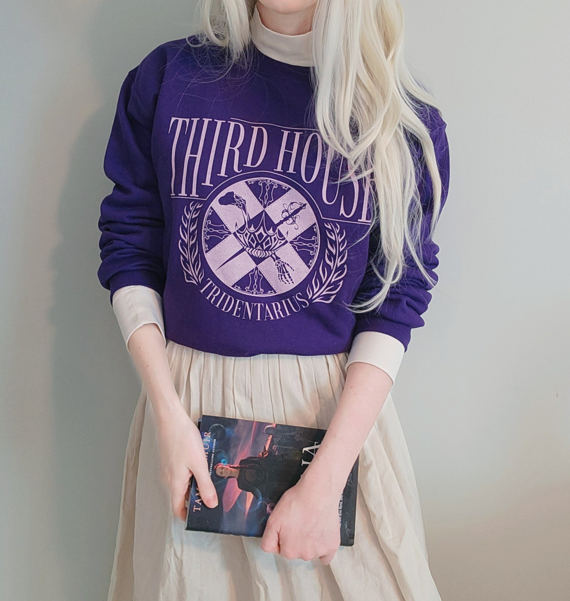 The locked tomb gideon the ninth third house sweatshirt in purple on model with ianthe type hair