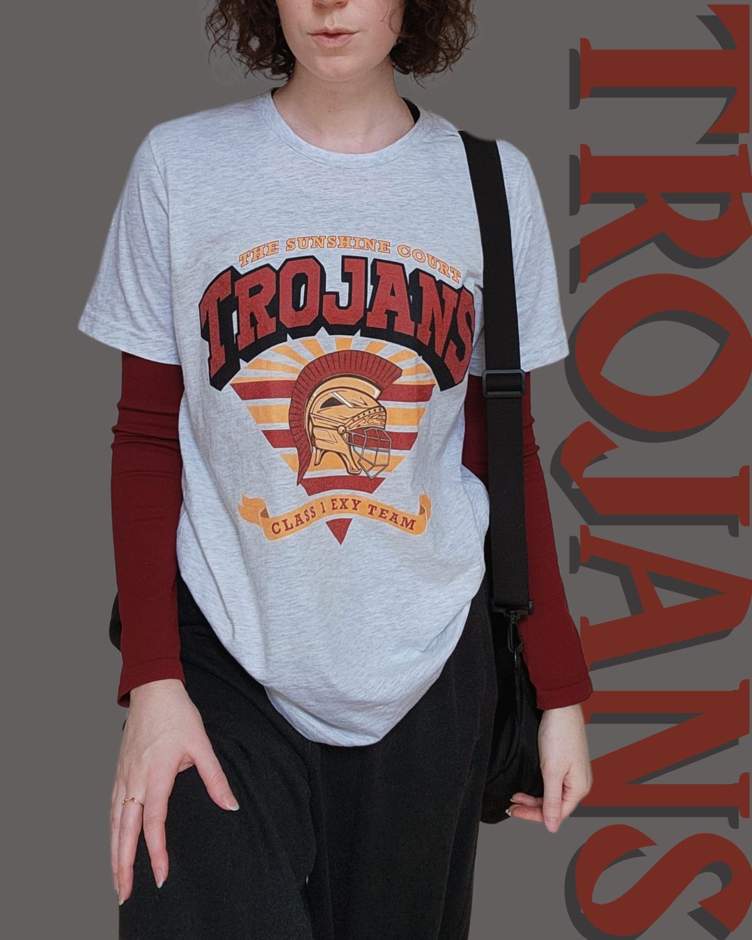 Trojans Sunshine Court Shirt in Grey on a Model styled with a red long sleeve shirt underneath