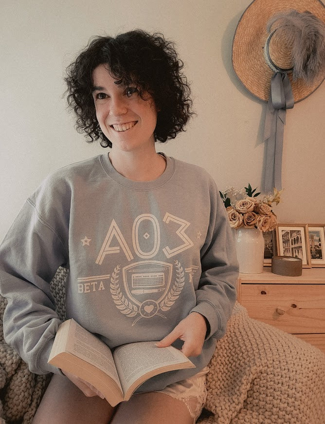 Model wearing the fanfic website inspired shirt with a sorority themed design in light blue