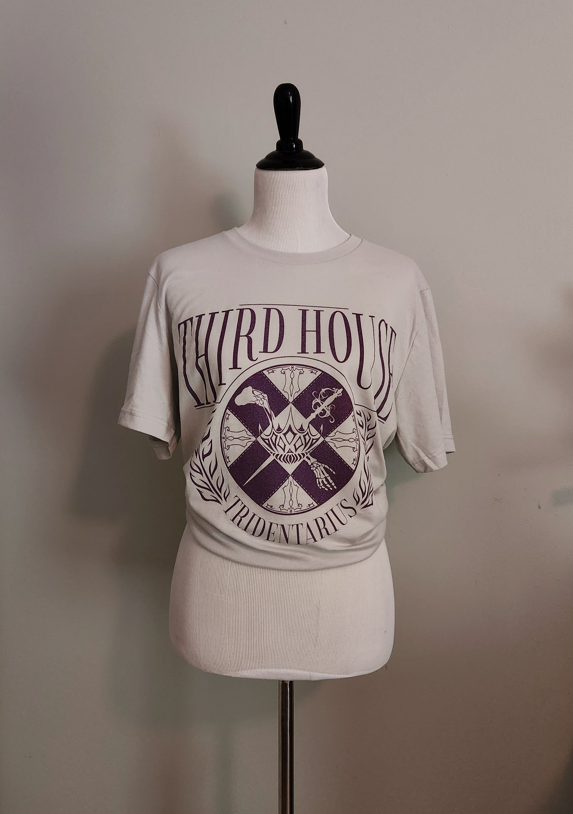 The locked tomb gideon the ninth third house shirt on a mannequin 